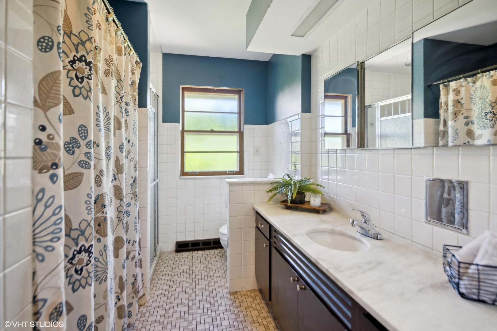250 East Harrison Road Lombard, IL 60148 - Photo 18 of 32 a bathroom with a granite countertop sink a mirror and shower