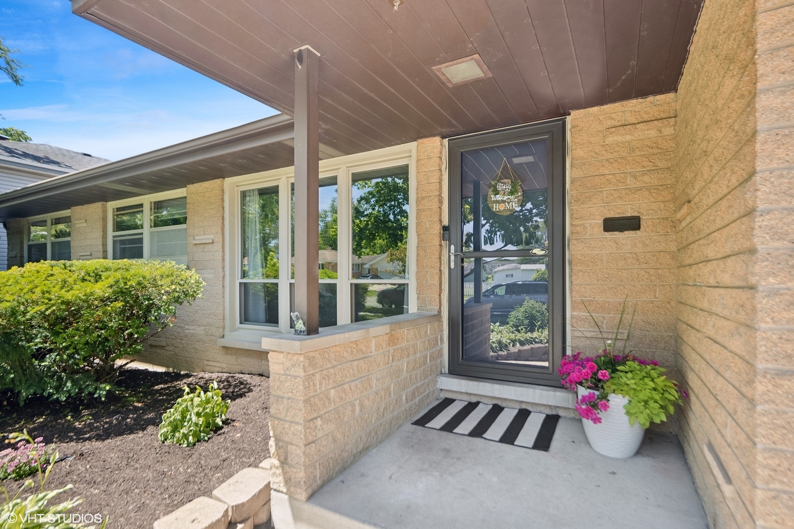 250 East Harrison Road Lombard, IL 60148 - Photo 3 of 32 a front view of a house with outdoor space