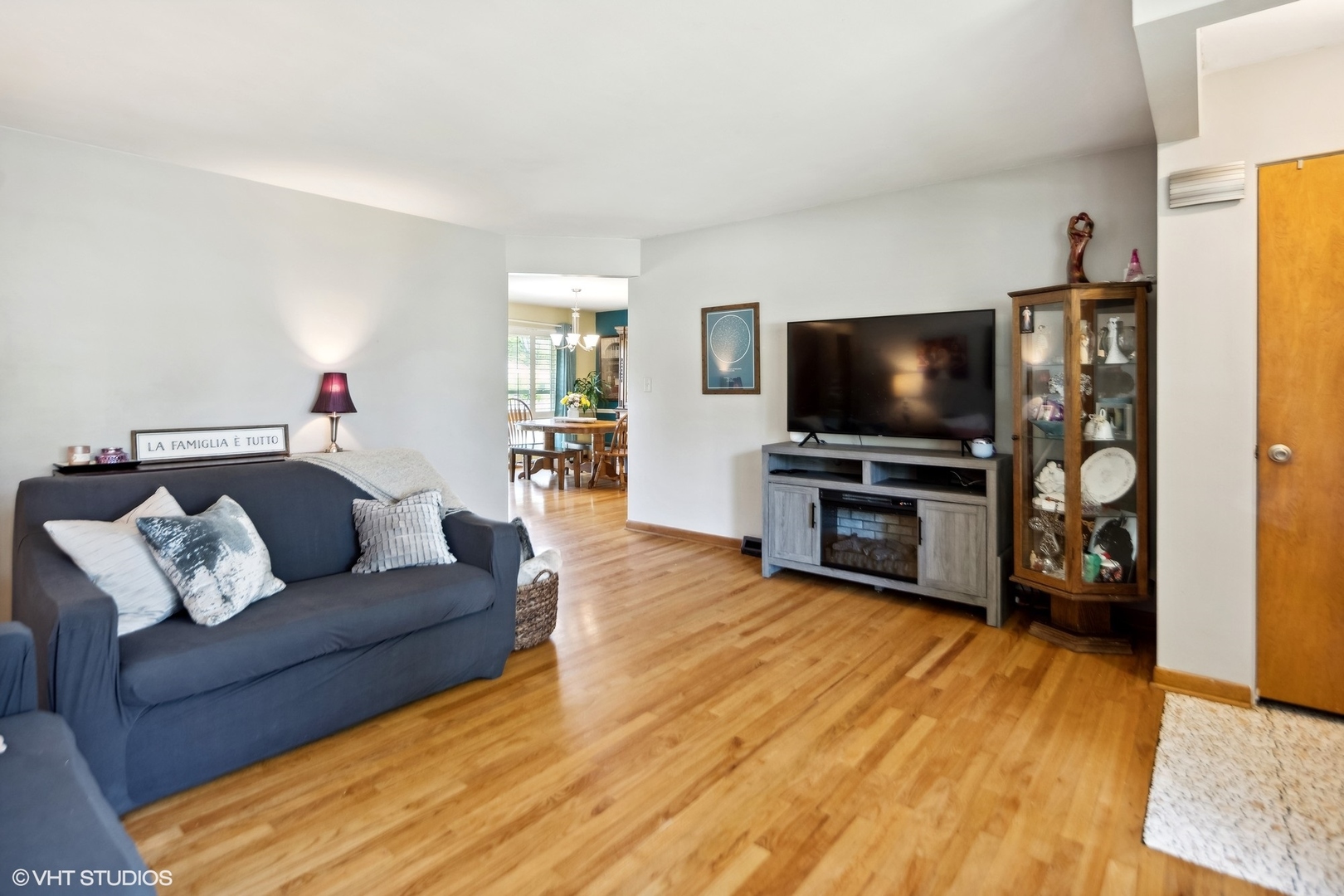 250 East Harrison Road Lombard, IL 60148 - Photo 7 of 32 a living room with furniture and a flat screen tv