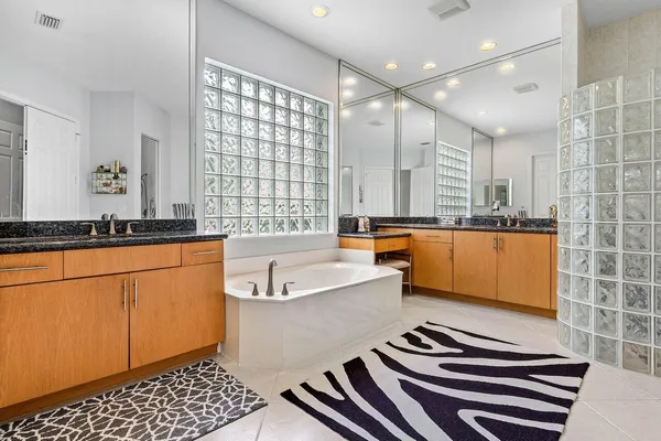 a bathroom with a bathtub and a sink