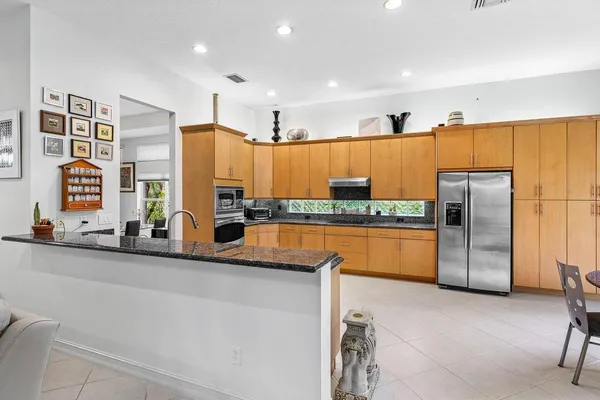 a kitchen with stainless steel appliances a refrigerator and a stove