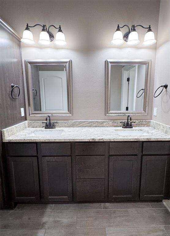 901 Lee Street Benton, LA 71006 - Photo 23 of 34 a bathroom with a double vanity sink and a mirror