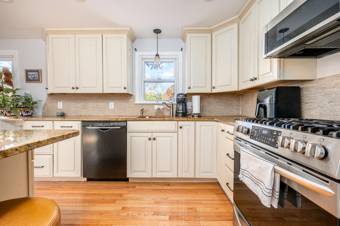 4 Oregon Road Mashpee, MA 02649 - Photo 13 of 31 a kitchen with granite countertop a stove sink and cabinets
