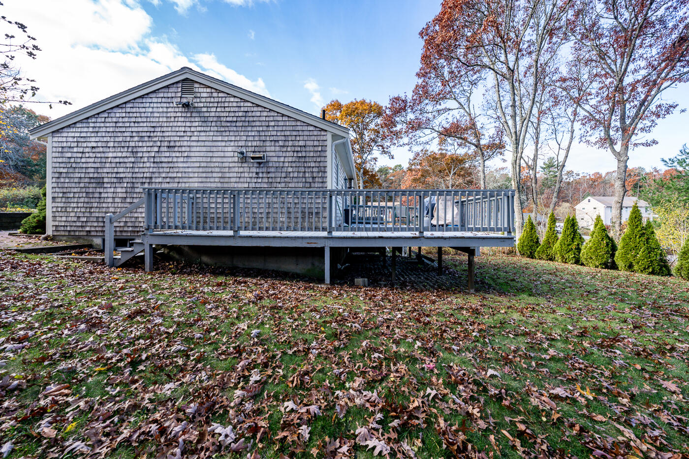 4 Oregon Road Mashpee, MA 02649 - Photo 30 of 31 a backyard of a house with lots of green space