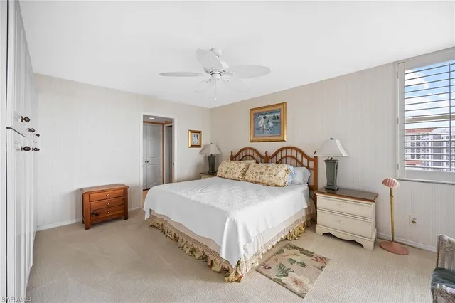 a bedroom with a bed and a chair