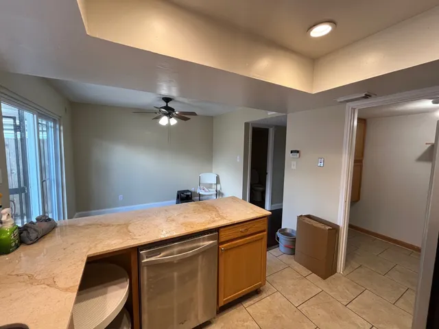 a room with a sink and chandelier