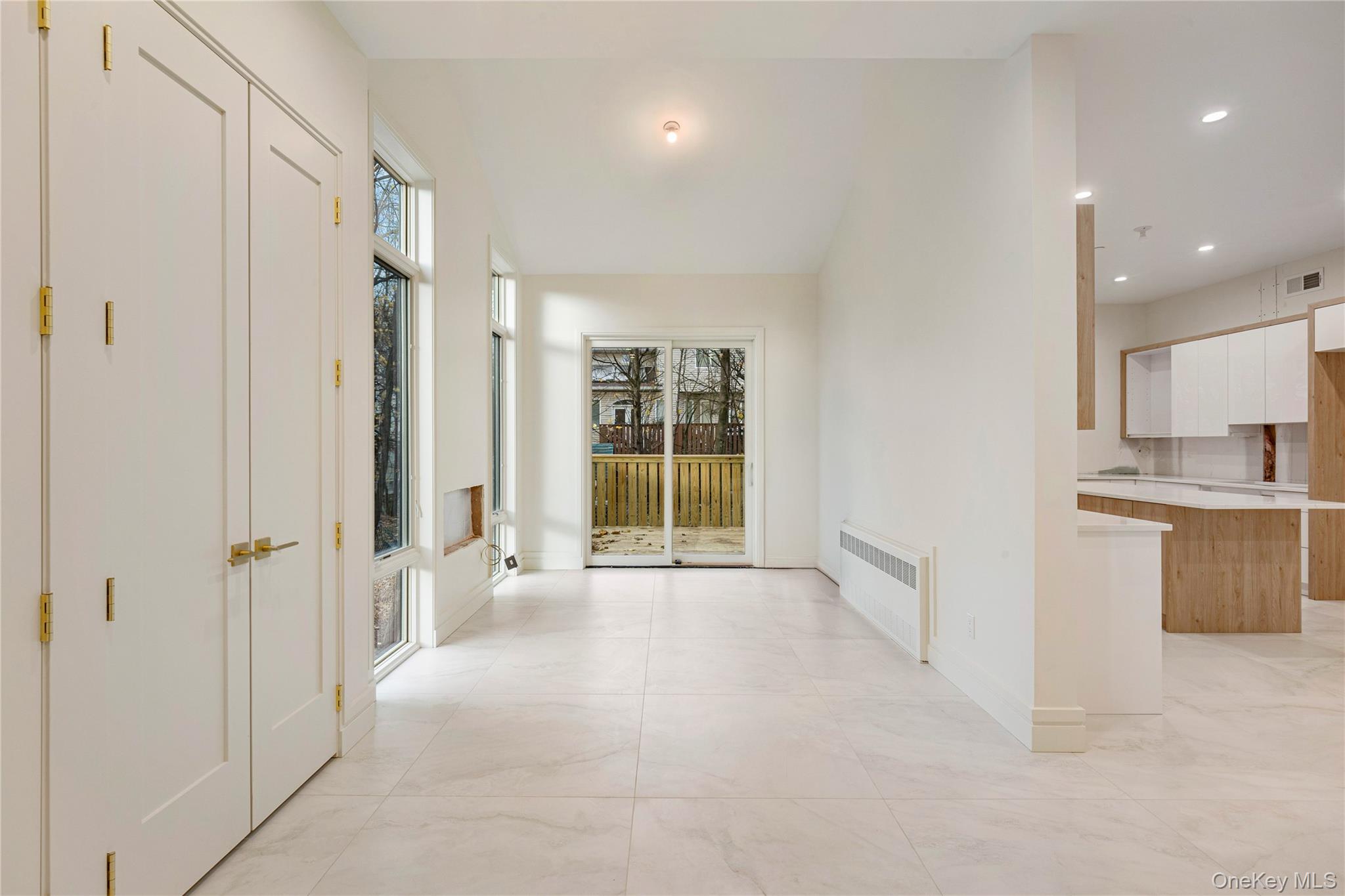 12 Buckman Place, Unit 101 Monsey, NY 10952 - Photo 13 of 50 Hall with radiator heating unit and recessed lighting