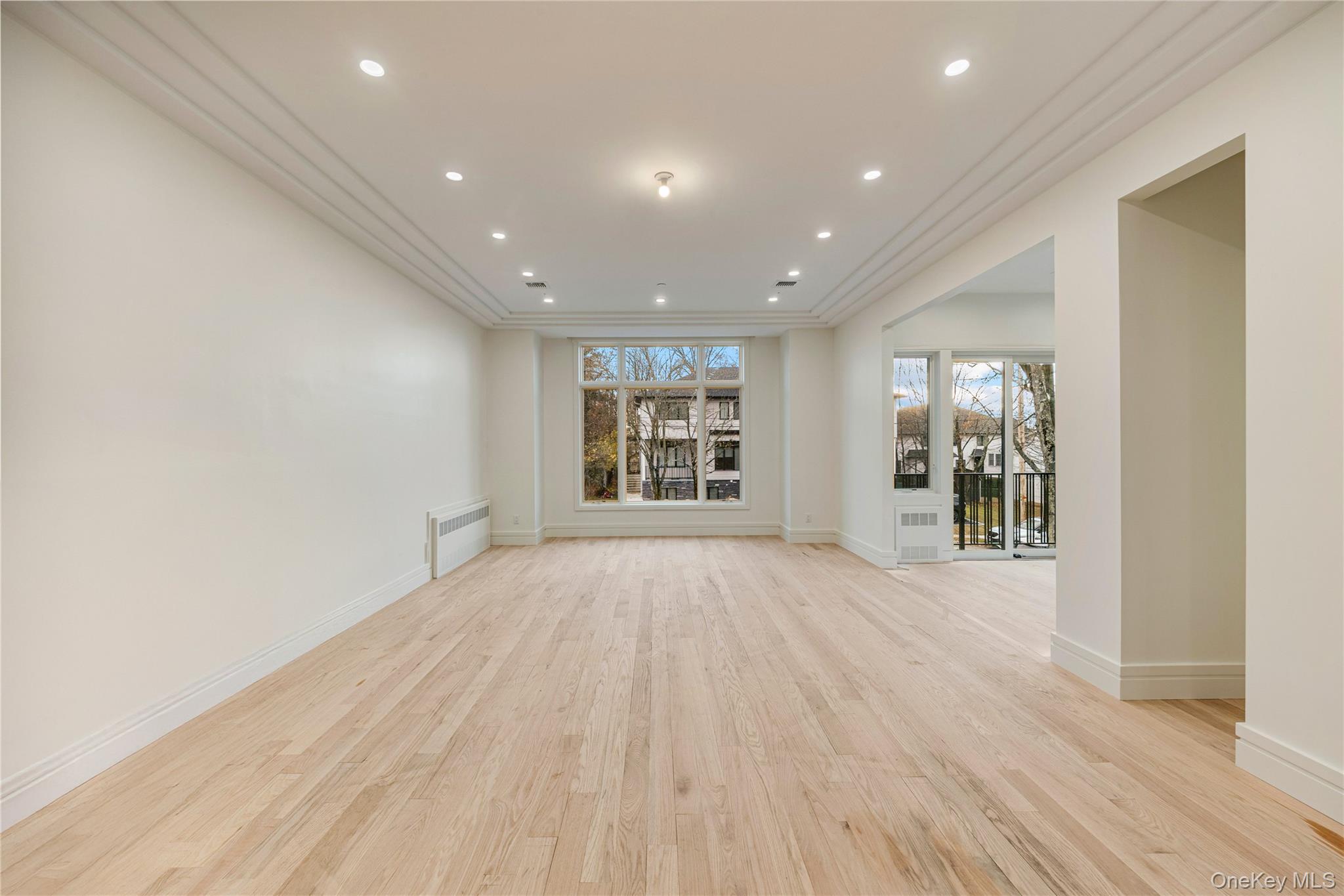 12 Buckman Place, Unit 101 Monsey, NY 10952 - Photo 17 of 50 Unfurnished room with recessed lighting, light wood-style flooring, and radiator heating unit