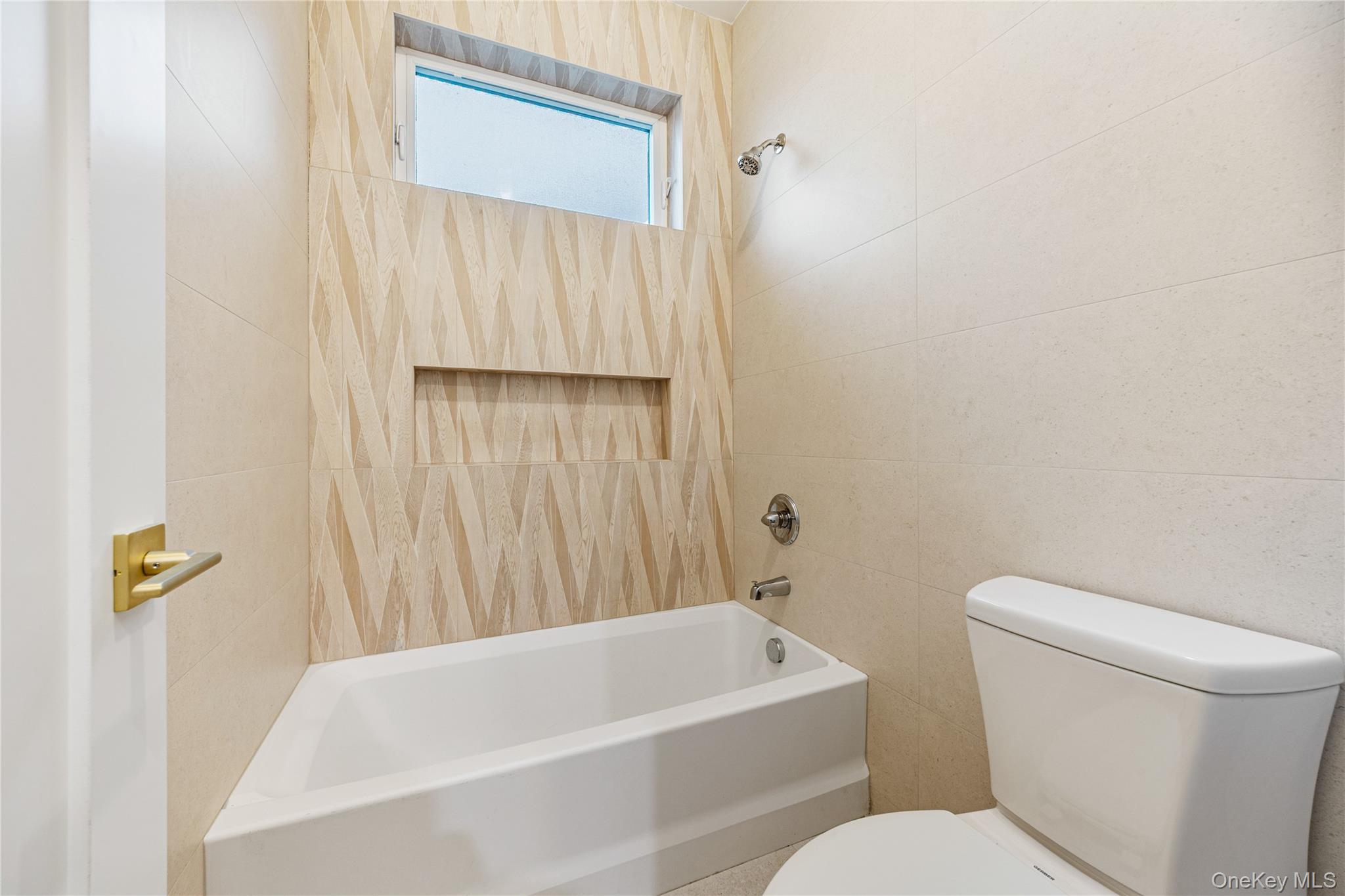 12 Buckman Place, Unit 101 Monsey, NY 10952 - Photo 30 of 50 Bathroom with shower / tub combination and tile walls