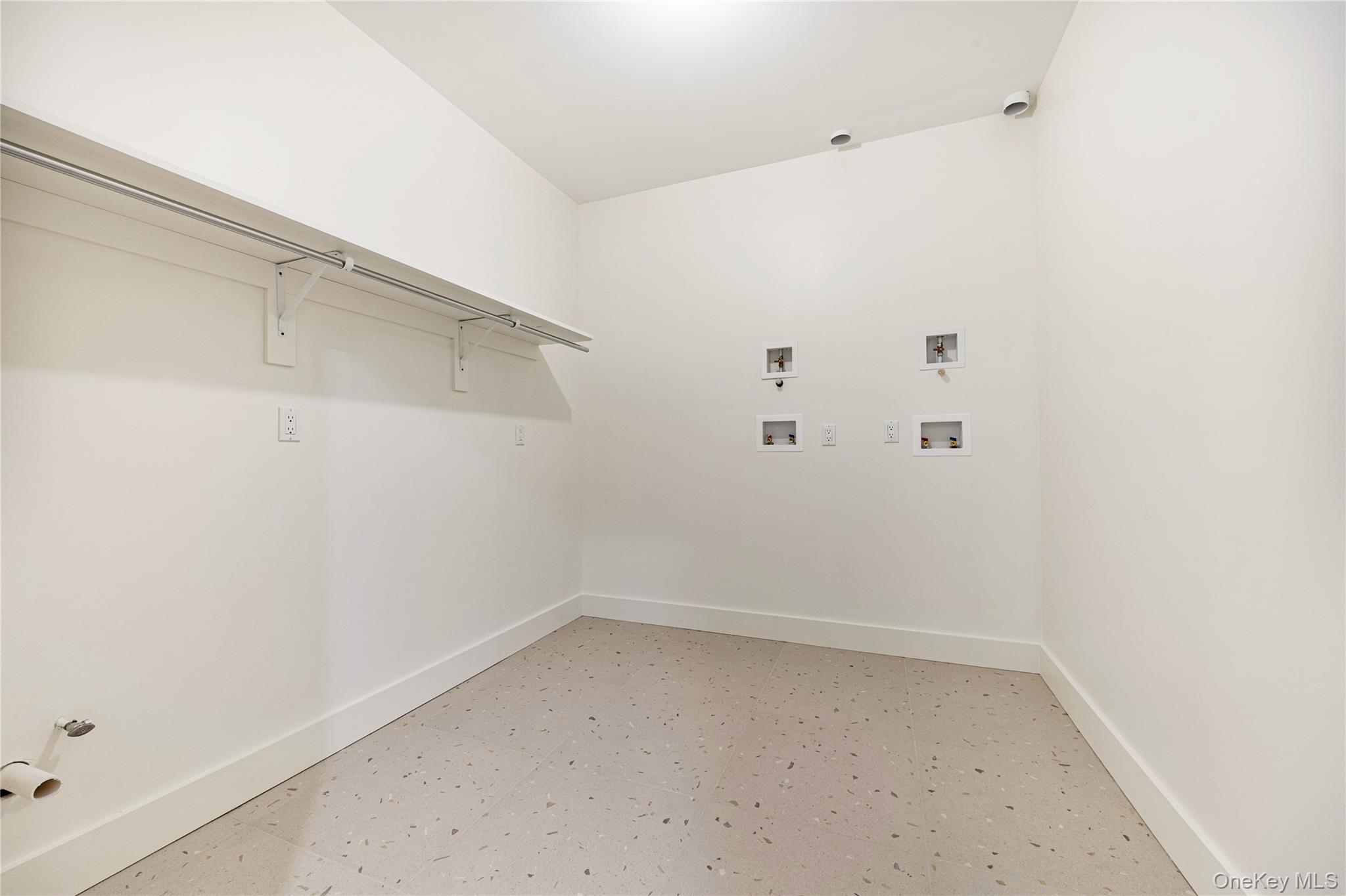12 Buckman Place, Unit 101 Monsey, NY 10952 - Photo 31 of 50 Laundry area with washer hookup and baseboards