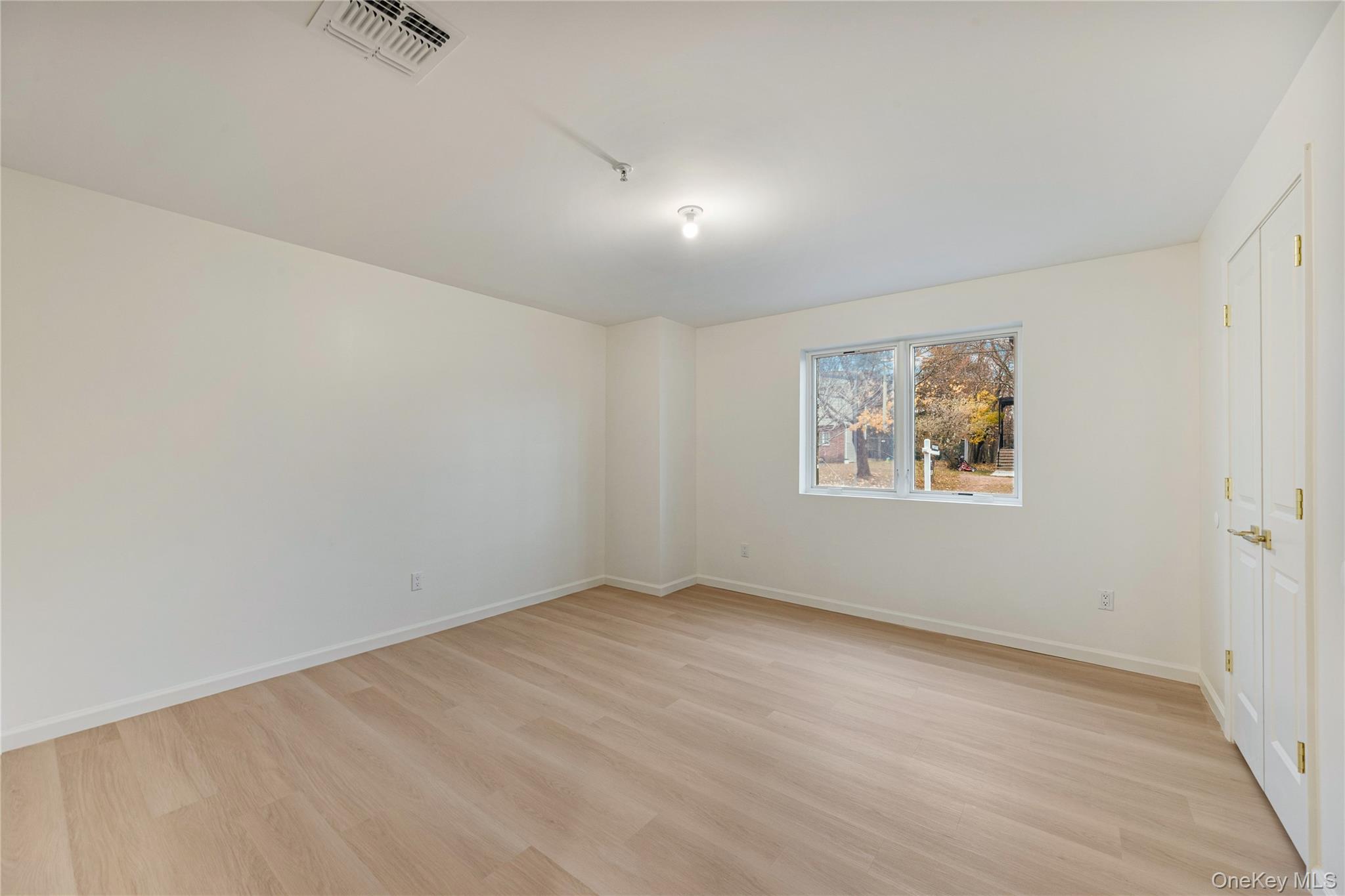 12 Buckman Place, Unit 101 Monsey, NY 10952 - Photo 50 of 50 Spare room featuring light wood finished floors and baseboards
