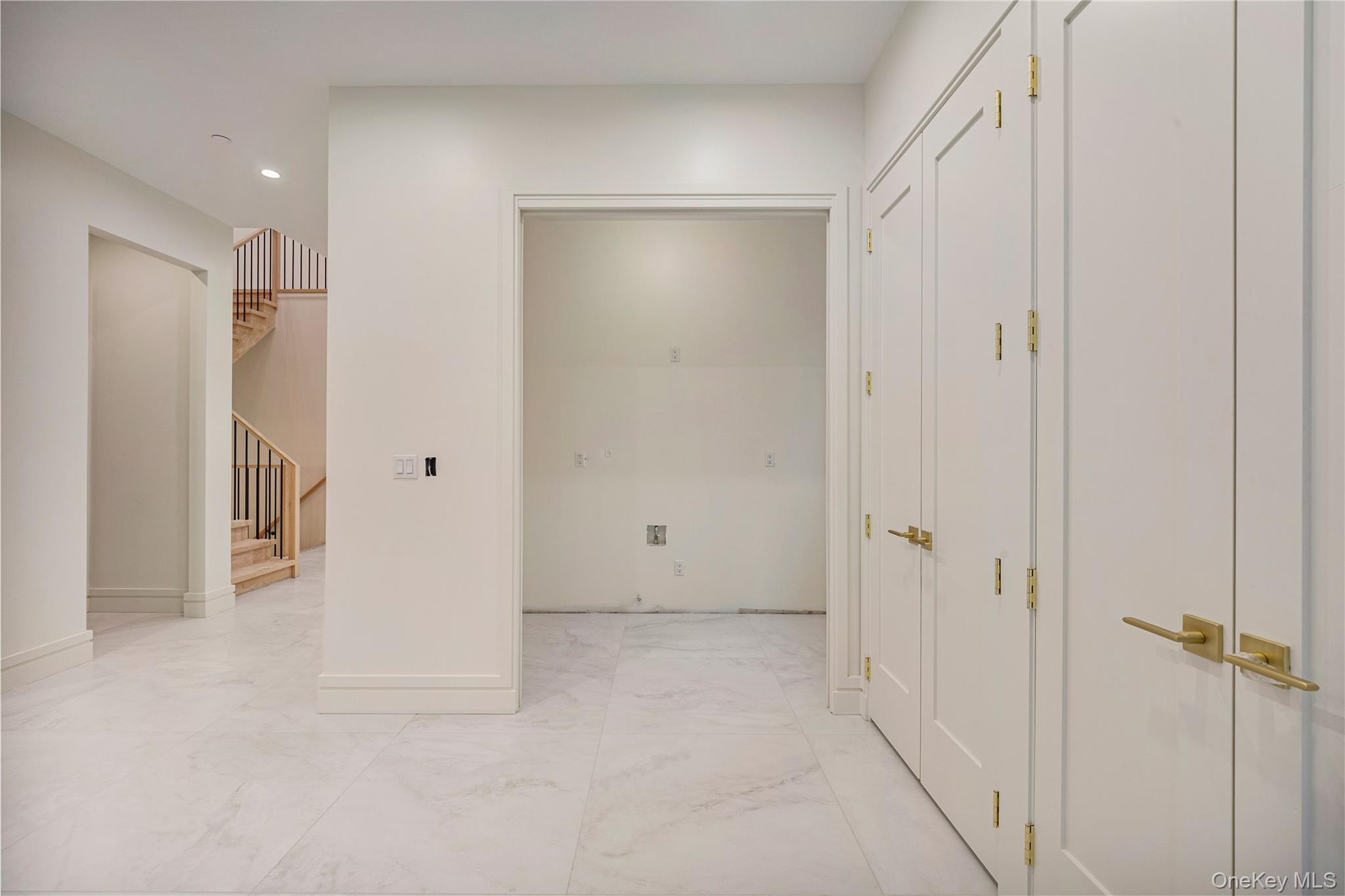 12 Buckman Place, Unit 101 Monsey, NY 10952 - Photo 6 of 50 Corridor featuring light marble finish floors, stairway, and recessed lighting