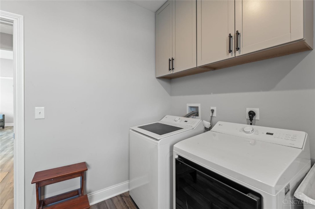 2425 Middleboro Road Clarksville, OH 45113 - Photo 52 of 91 This dedicated laundry space combines efficiency with smart storage solutions.