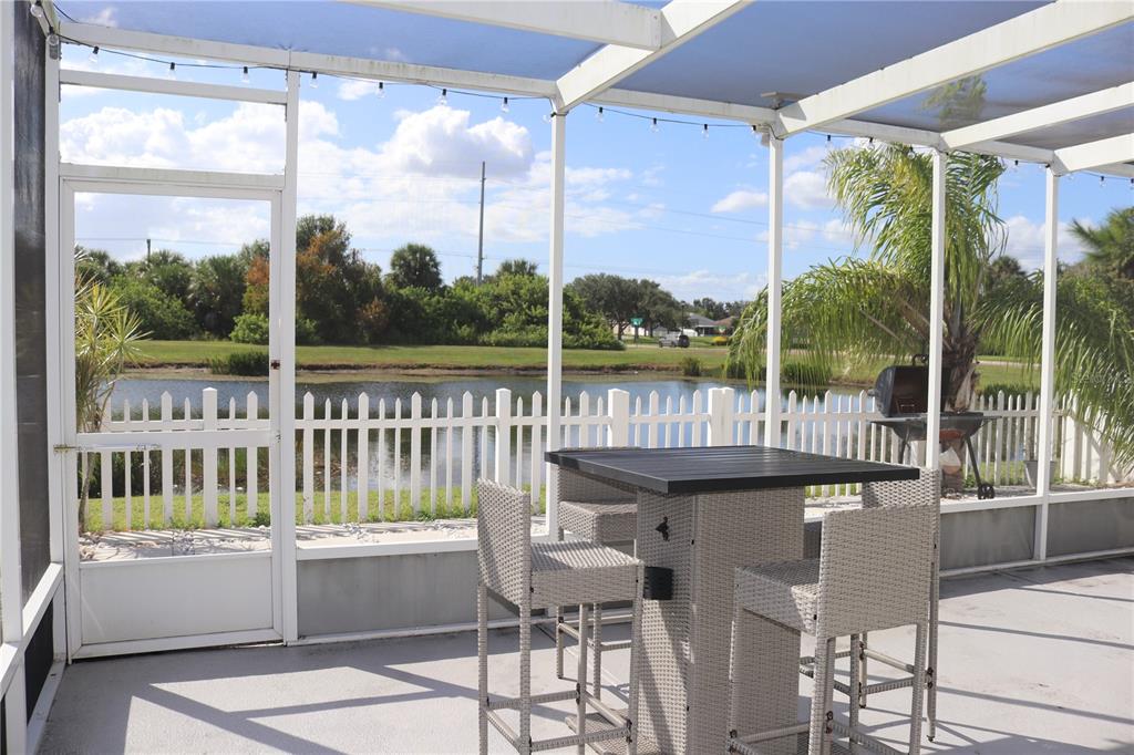 12107 Barnsley Reserve Place Gibsonton, FL 33534 - Photo 19 of 26 a balcony with table and chairs