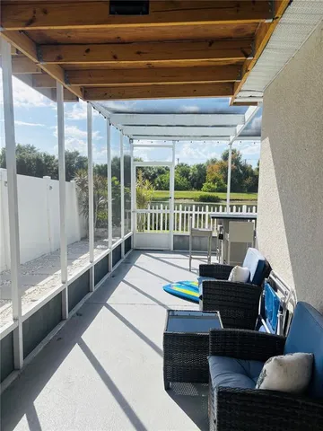 a view of a patio with a table chairs and a patio