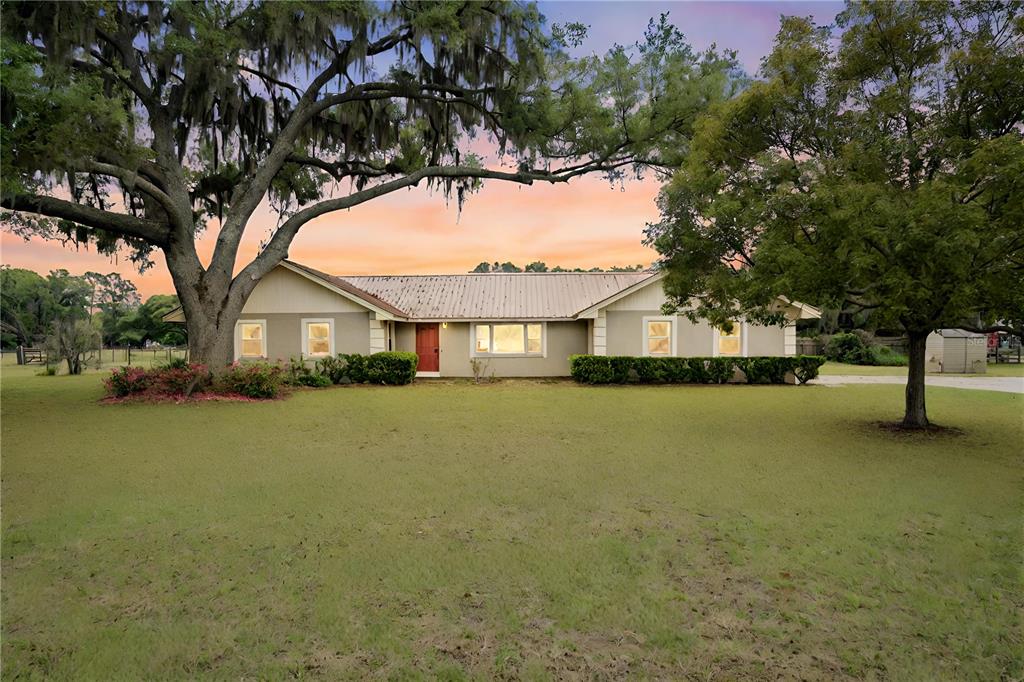 4929 Rushing Road Lakeland, FL 33810 - Photo 1 of 1 a front view of a house with a garden