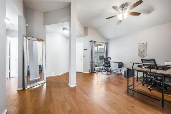 a view of a livingroom with workspace and a workspace