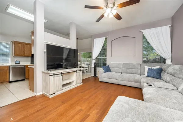 a living room with furniture and a flat screen tv