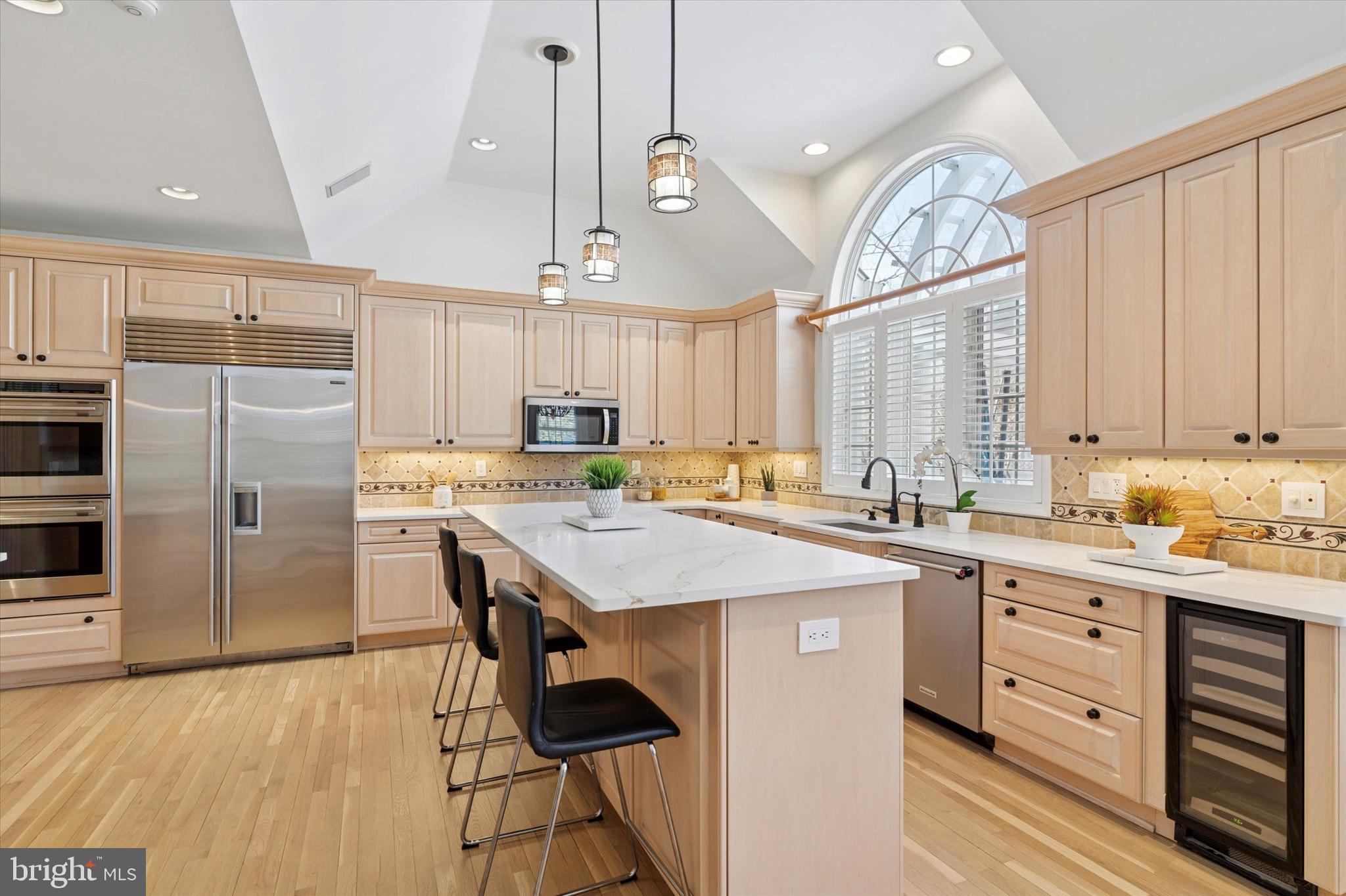 701 Brushtown Road Lower Gwynedd, PA 19002 - Photo 13 of 61 a kitchen with a refrigerator a sink dishwasher a stove and a oven with wooden floor