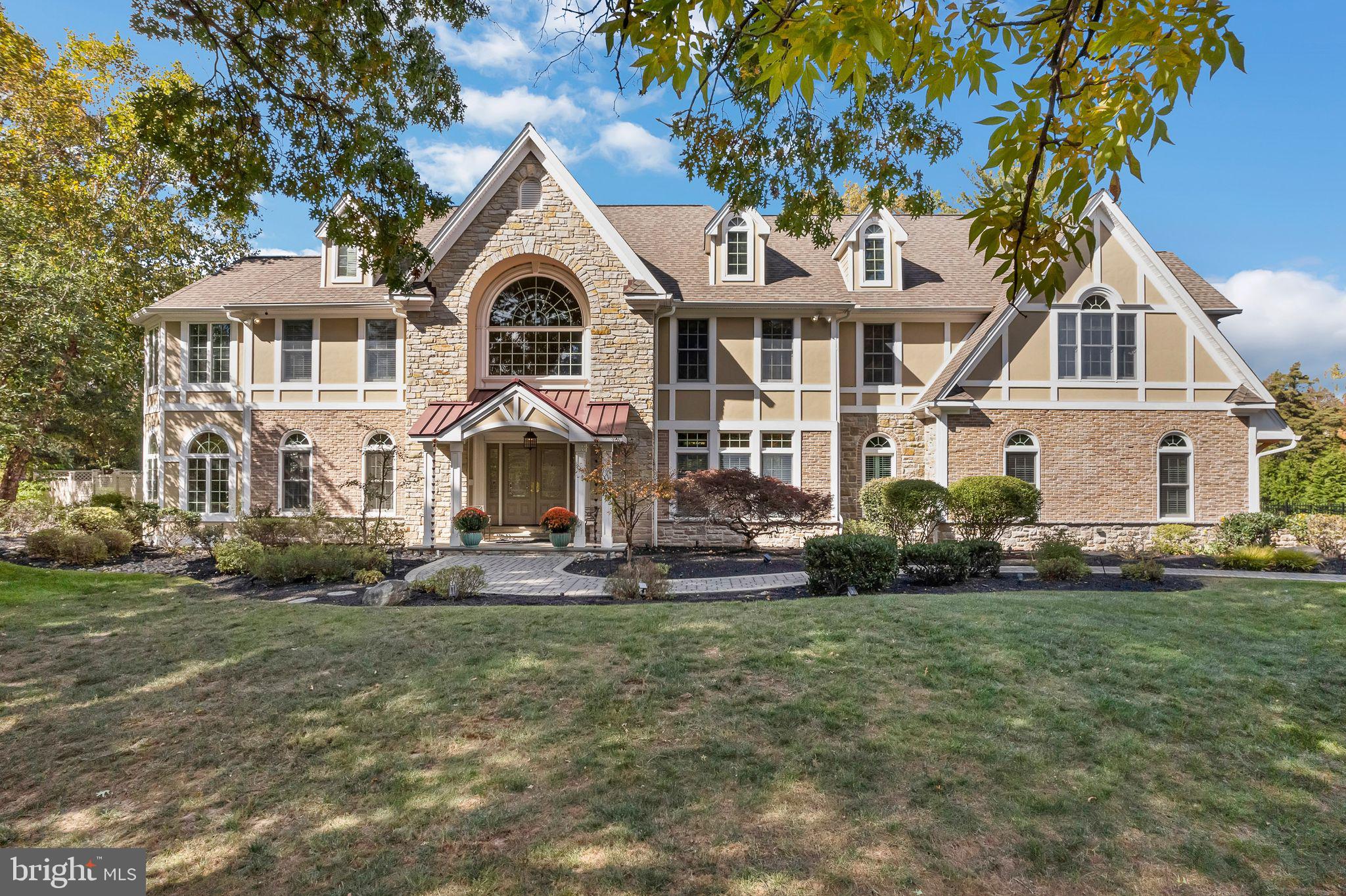 701 Brushtown Road Lower Gwynedd, PA 19002 - Photo 44 of 61 a front view of a house with a garden