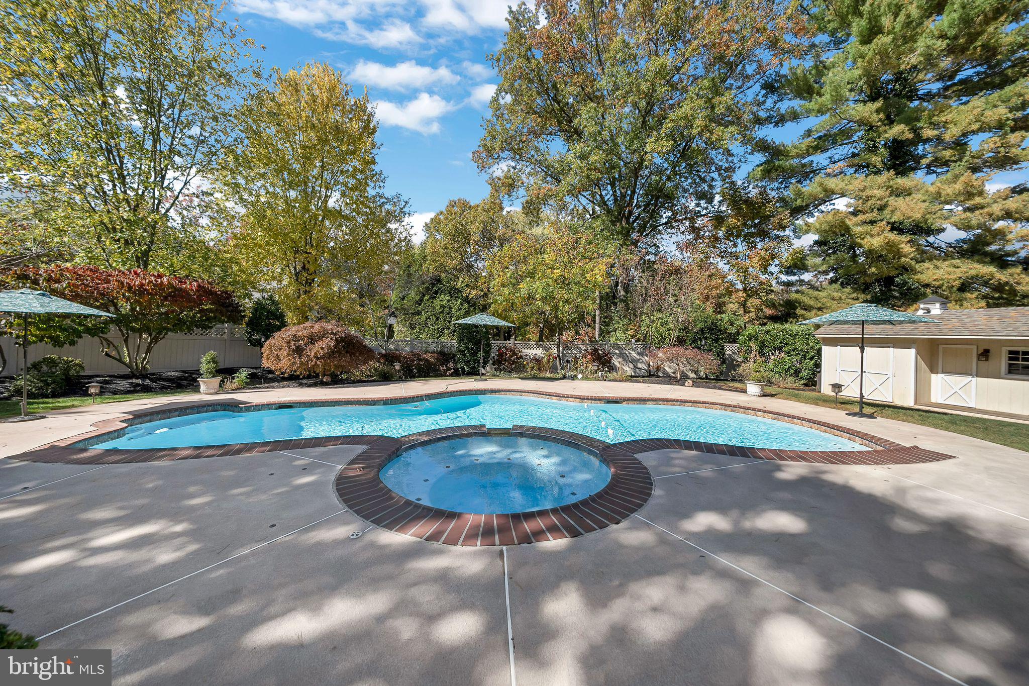 701 Brushtown Road Lower Gwynedd, PA 19002 - Photo 50 of 61 a view of a swimming pool with an outdoor space