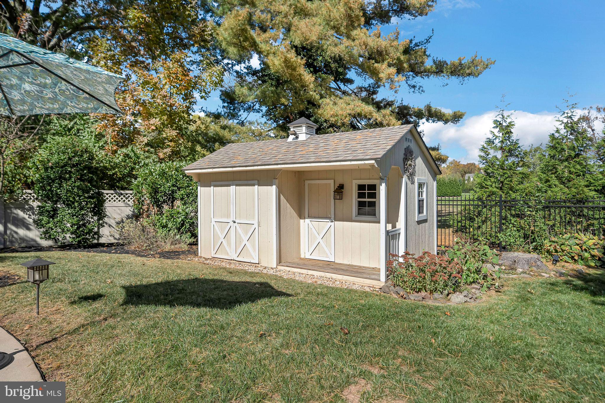 701 Brushtown Road Lower Gwynedd, PA 19002 - Photo 56 of 61 a front view of a house with a garden