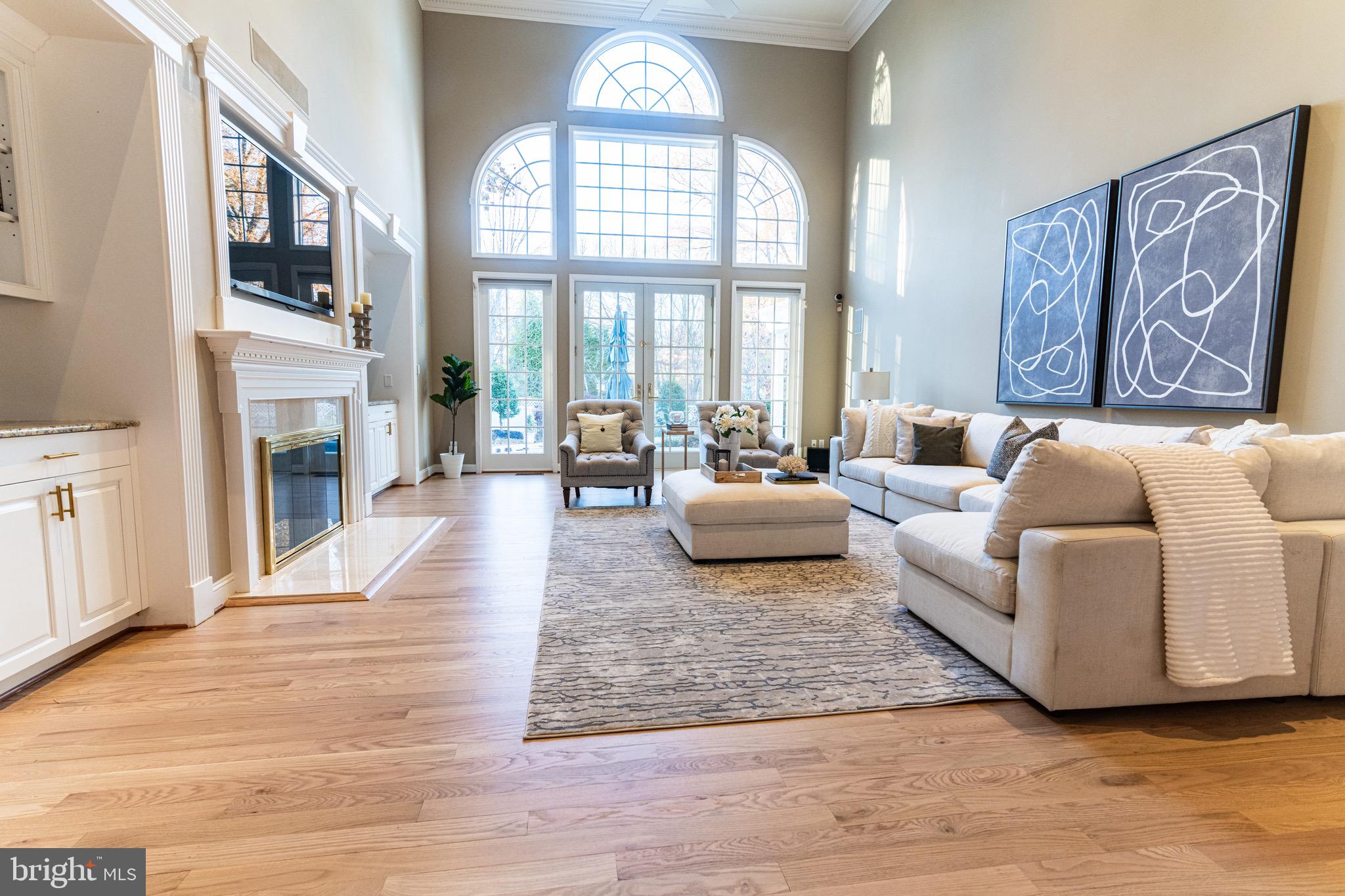 701 Brushtown Road Lower Gwynedd, PA 19002 - Photo 9 of 61 a living room with furniture fireplace and a large window