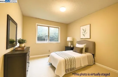 a bathroom with a double vanity sink a toilet and a bathtub
