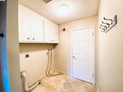 a bathroom with a shower a toilet and a window