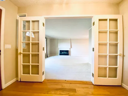 a dining room with furniture a rug and a chandelier