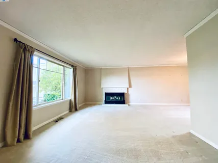 a large kitchen with stainless steel appliances a sink and cabinets