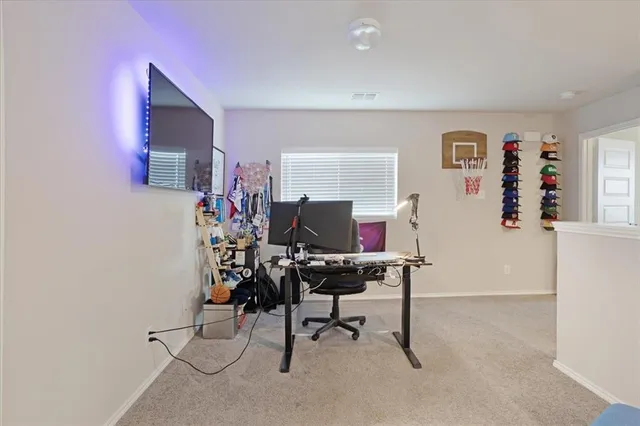 a view of a workspace with furniture