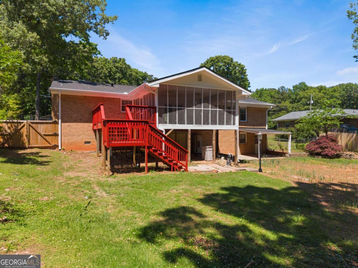 865 Old Tucker Road Stone Mountain, GA 30087 - Photo 48 of 57 a view of a house with a yard