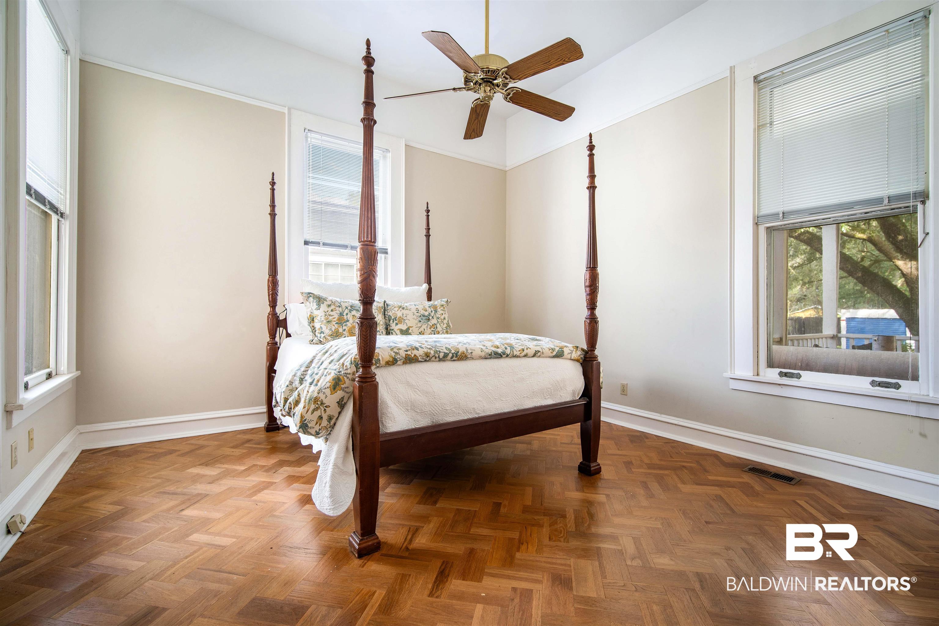 1314 Dauphin Street Mobile, AL 36604 - Photo 28 of 61 Bedroom featuring ceiling fan and hardwood floors