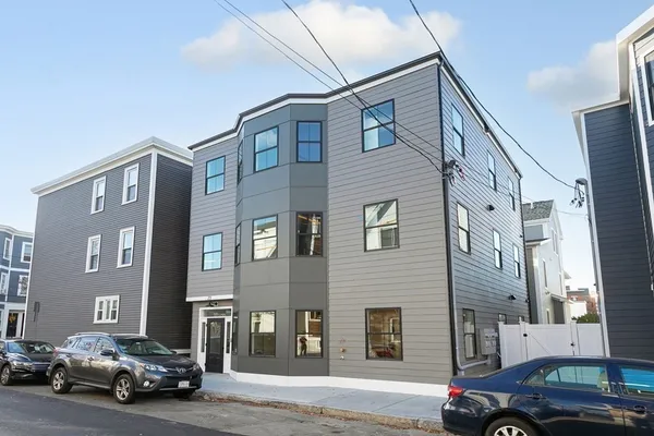a view of a car parked in front of a building
