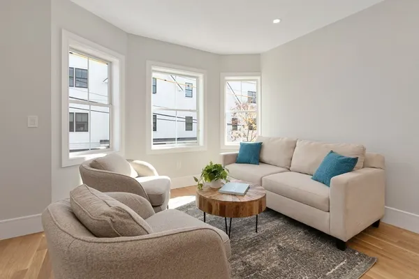 a living room with furniture and windows