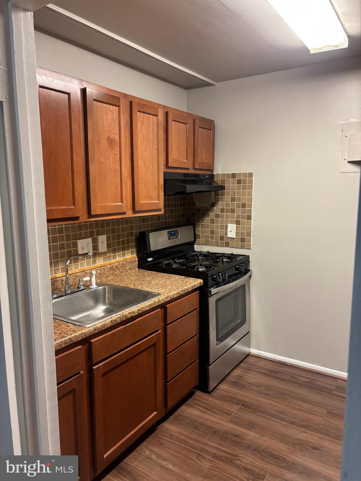 3853 St Barnabas Road, Unit 202 Suitland, MD 20746 - Photo 7 of 20 a kitchen with a sink stove and microwave