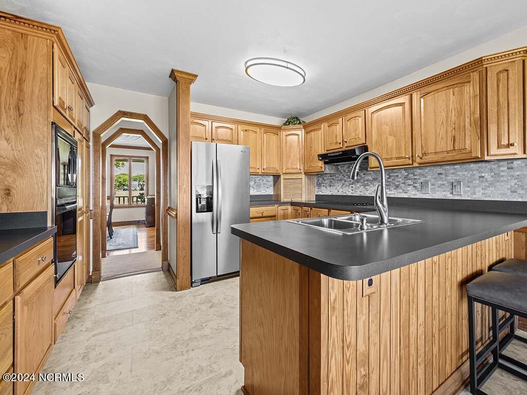 145 Ferry Dock Road Knotts Island, NC 27950 - Photo 25 of 79 Offering a breakfast bar, updated fixtures & appliances