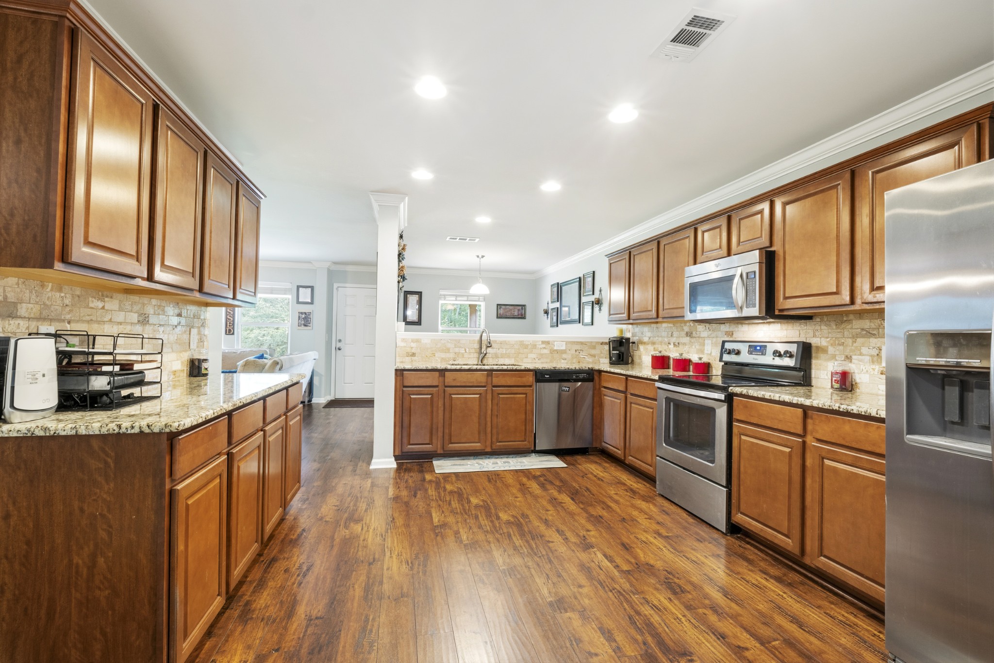 1011 Benwick Road Hendersonville, TN 37075 - Photo 16 of 60 a kitchen with stainless steel appliances granite countertop lots of counter top space a sink and cabinets
