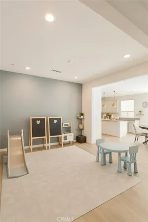 a living room with furniture a table and chairs