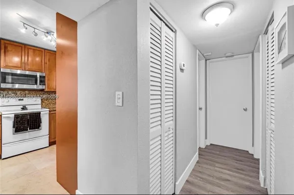 a view of a kitchen from the hallway