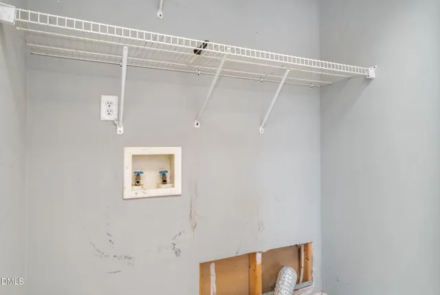 a view of a room with a walk in closet