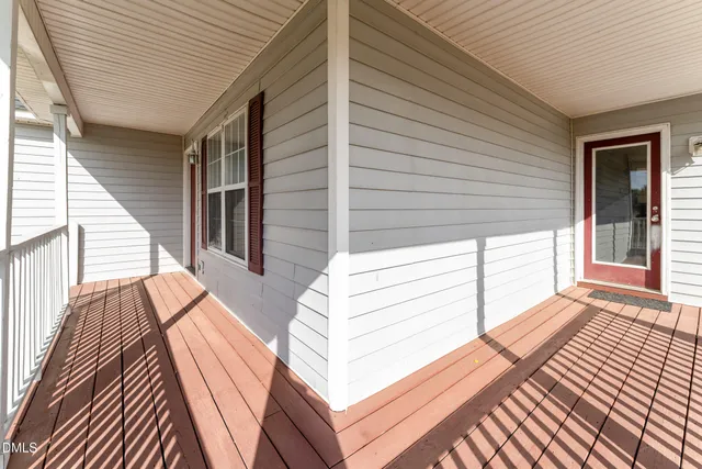 a view of two chairs in the balcony