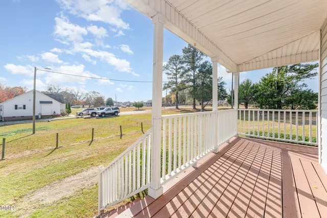 a view of balcony with wooden floor