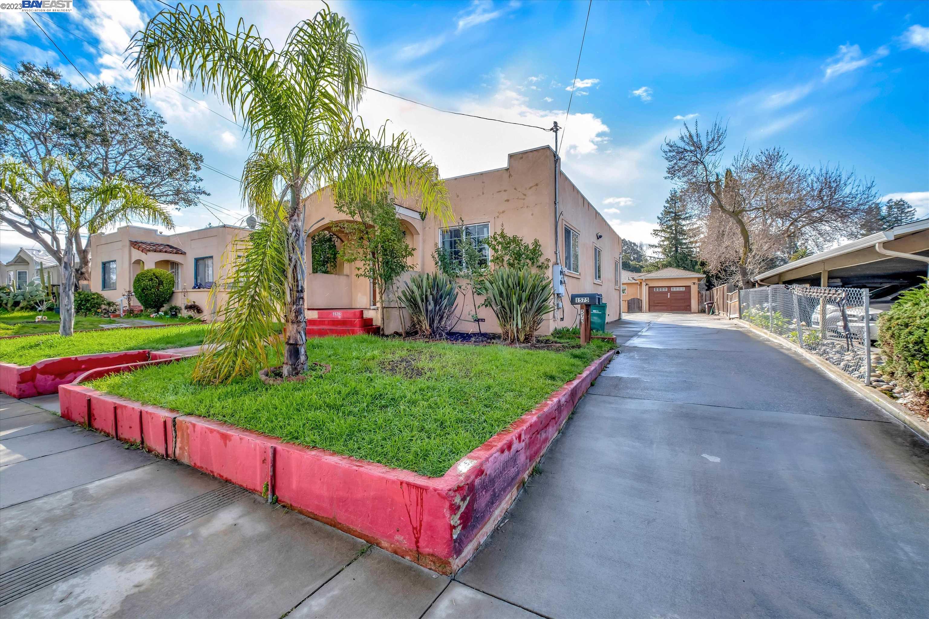 a view of a park with large trees
