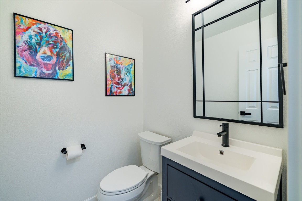 1130 Sundrop Place Round Rock, TX 78665 - Photo 11 of 18 a bathroom with a sink mirror and toilet