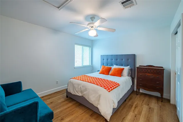 a bedroom with a bed and a couch