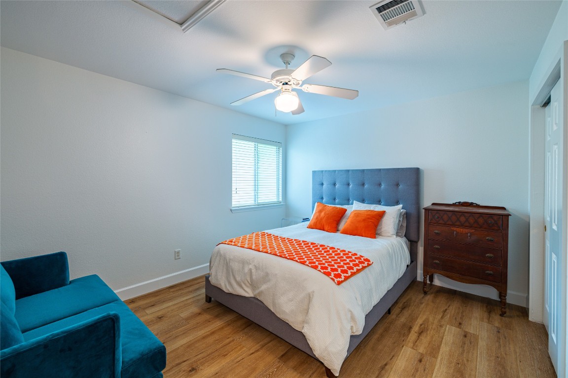 1130 Sundrop Place Round Rock, TX 78665 - Photo 14 of 18 a bedroom with a bed and a couch