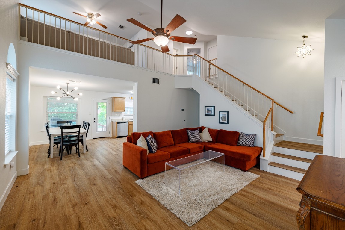 1130 Sundrop Place Round Rock, TX 78665 - Photo 3 of 18 a living room with furniture ceiling fan and a rug