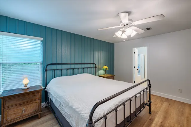 a bed room with a bed and a chandelier